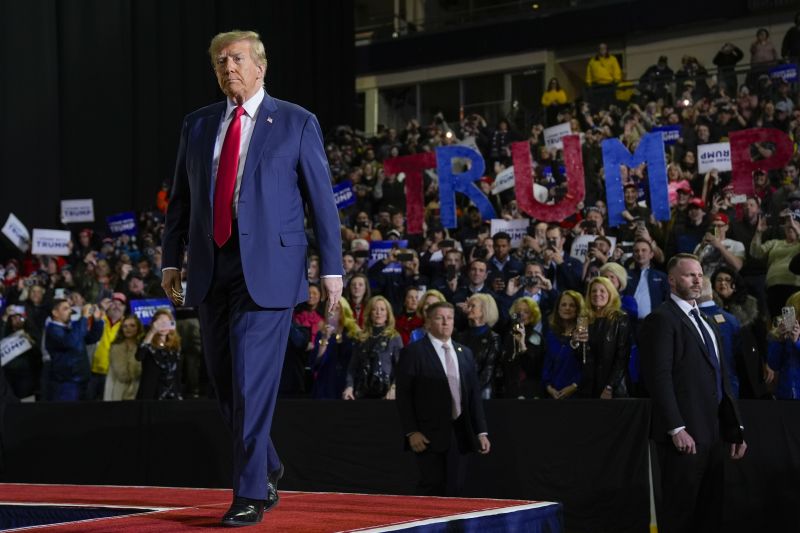 Republican presidential candidate former President Donald Trump walking toward the podium before his remark at a campaign event in Manchester, N.H., Saturday, Jan. 20, 2024.