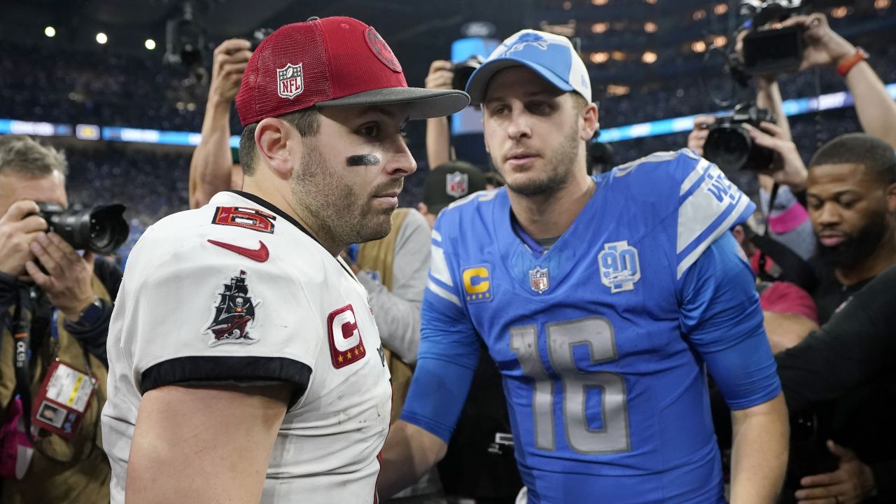 Tampa Bay Buccaneers quarterback Baker Mayfield, left, and Detroit Lions quarterback Jared Goff (16) meet on the field following an NFL football NFC divisional playoff game, Sunday, Jan. 21, 2024, in Detroit. The Lions won 31-23. (AP Photo/Carlos Osorio)