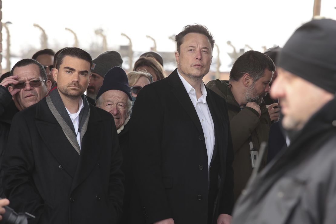 X owner Elon Musk, centre, walks during his visit to the site of the Auschwitz-Birkenau Nazi German death camp in Poland, on Monday, Jan. 22, 2024, ahead of a speech at a conference hosted by the European Jewish Association.