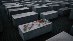Flowers lie on a concrete slab of the Holocaust Memorial to mark the International Holocaust Remembrance Day and commemorating the 70th anniversary of the liberation of the Nazi Auschwitz death camp in Berlin in January 2015.