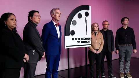 From left, Bulletin of the Atomic Scientists members Asha George, and Herb Lin, science educator Bill Nye, Bulletin of the Atomic Scientists President and CEO Rachel Bronson, and Bulletin members Alexander Glaser, and Daniel Holz, pose for a photograph with the "Doomsday Clock," shortly before the Bulletin of the Atomic Scientists announced the latest decision on the "Doomsday Clock" minute hand, Tuesday, Jan. 23, 2024, at the National Press Club Broadcast Center, in Washington. This year, Jan. 2024, the clock will remain set to 90 seconds to midnight. (AP Photo/Jacquelyn Martin)