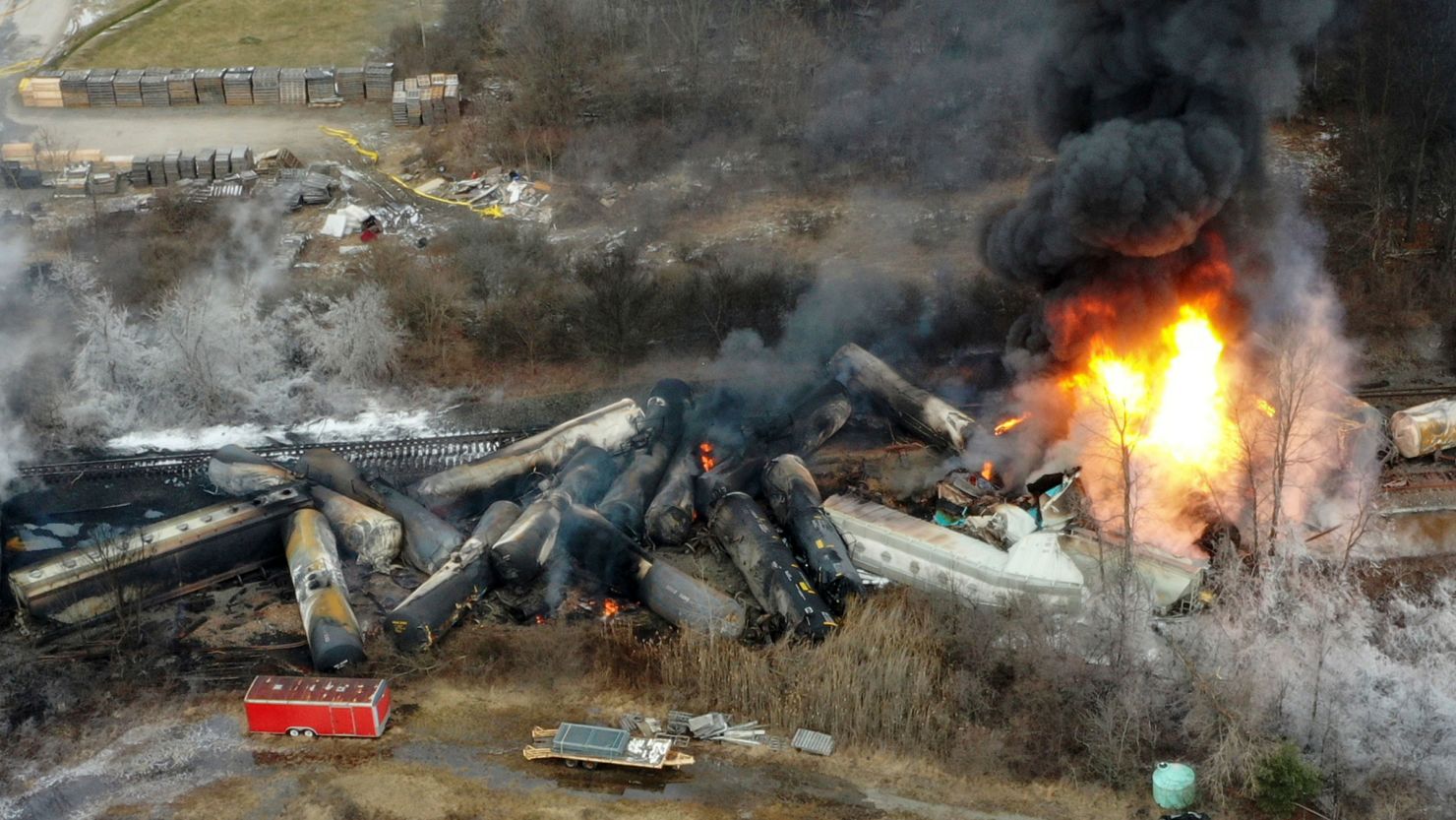 Portions of a Norfolk Southern freight train that derailed the night before burn in East Palestine, Ohio, on February 4, 2023.