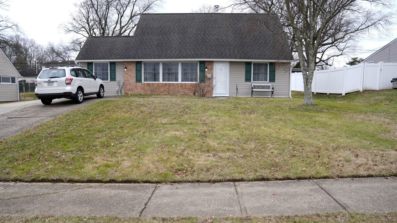 A vehicle is parked in the driveway of a home that was a scene of a murder in Levittown, Pa., on Wednesday, Jan. 31, 2024. A man has been charged with first-degree murder and abusing a corpse after his father was found decapitated. Police are investigating a video on social media that allegedly shows him holding up the head. The father was found beheaded in the bathroom of his home in Levittown, on Tuesday night.  (AP Photo/Matt Rourke)