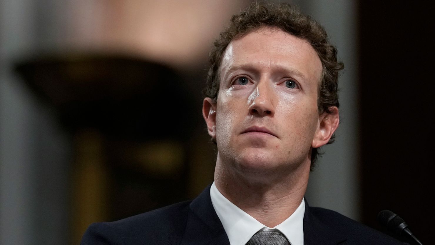 Meta CEO Mark Zuckerberg listens during a Senate Judiciary Committee hearing with other social media platform heads in Washington, DC, on January 31, 2024.