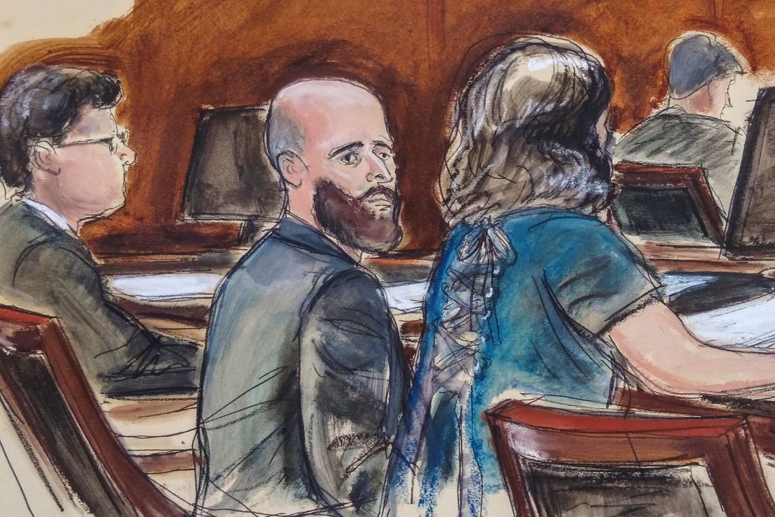 In this courtroom sketch, Joshua Schulte, center, is seated at the defense table flanked by his attorneys during jury deliberations, March 4, 2020, in New York.