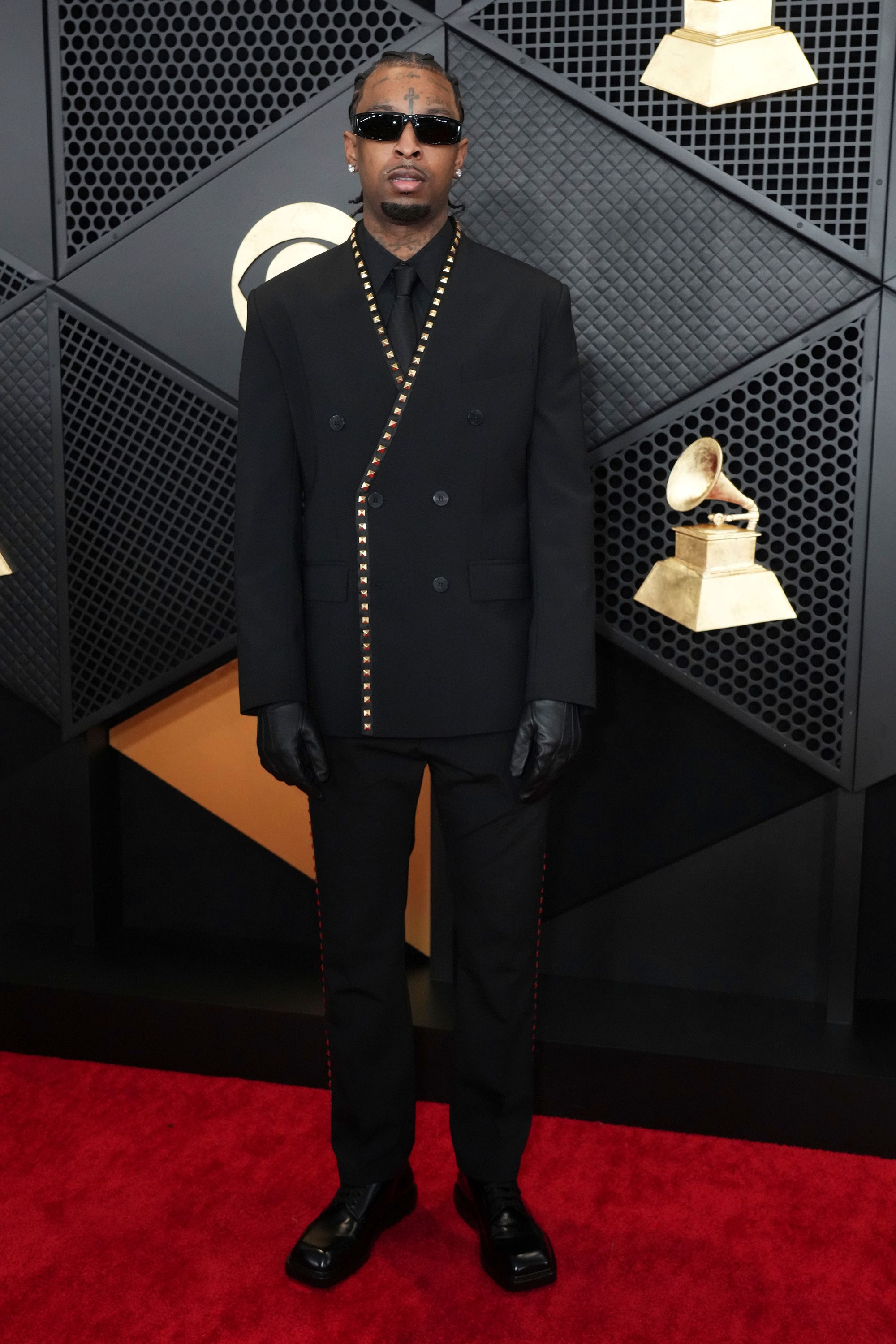 Rapper 21 Savage wore a black double-breasted Courrèges suit with metal stud accents.