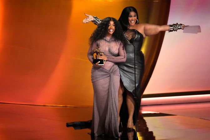 Lizzo, right, presents SZA with the Grammy for best R&B song ("Snooze"). “Lizzo and I have been friends since 2013, when we were both on a tiny Red Bull tour together,” <a href="https://www.cnn.com/2024/02/04/entertainment/sza-grammys-win/index.html">SZA explained</a>. ”Opening up in small rooms for like a hundred people, and to be on the stage with her is so amazing. I’m so grateful.”