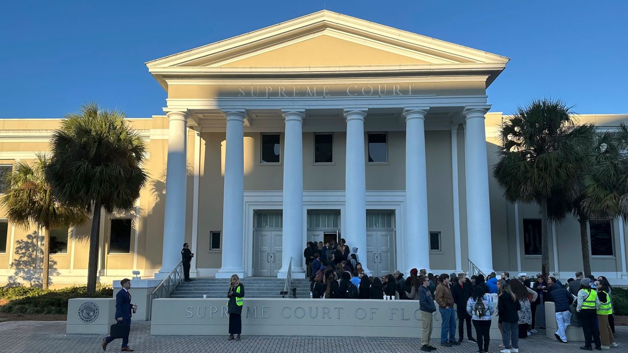 People gather outside the Florida Supreme Court, where justices will hear arguments on a proposed ballot issue regarding abortion on Wednesday, Feb. 7, 2024 in Tallahassee, Fla.  Florida's attorney general is expected to ask the state Supreme Court to keep an abortion-rights measure off November's ballot on Wednesday, saying it misleads voters and could be used to expand abortion rights in the future. (AP Photo/Brendan Farrington)