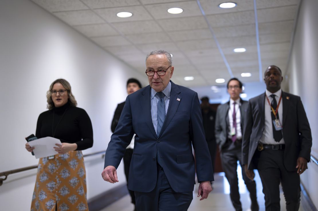 Senate Majority Leader Chuck Schumer walks to meet reporters at the Capitol in Washington, DC on Wednesday.