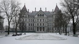 Snow covers the exterior of the New York state Capitol in Albany on January 16, 2024.