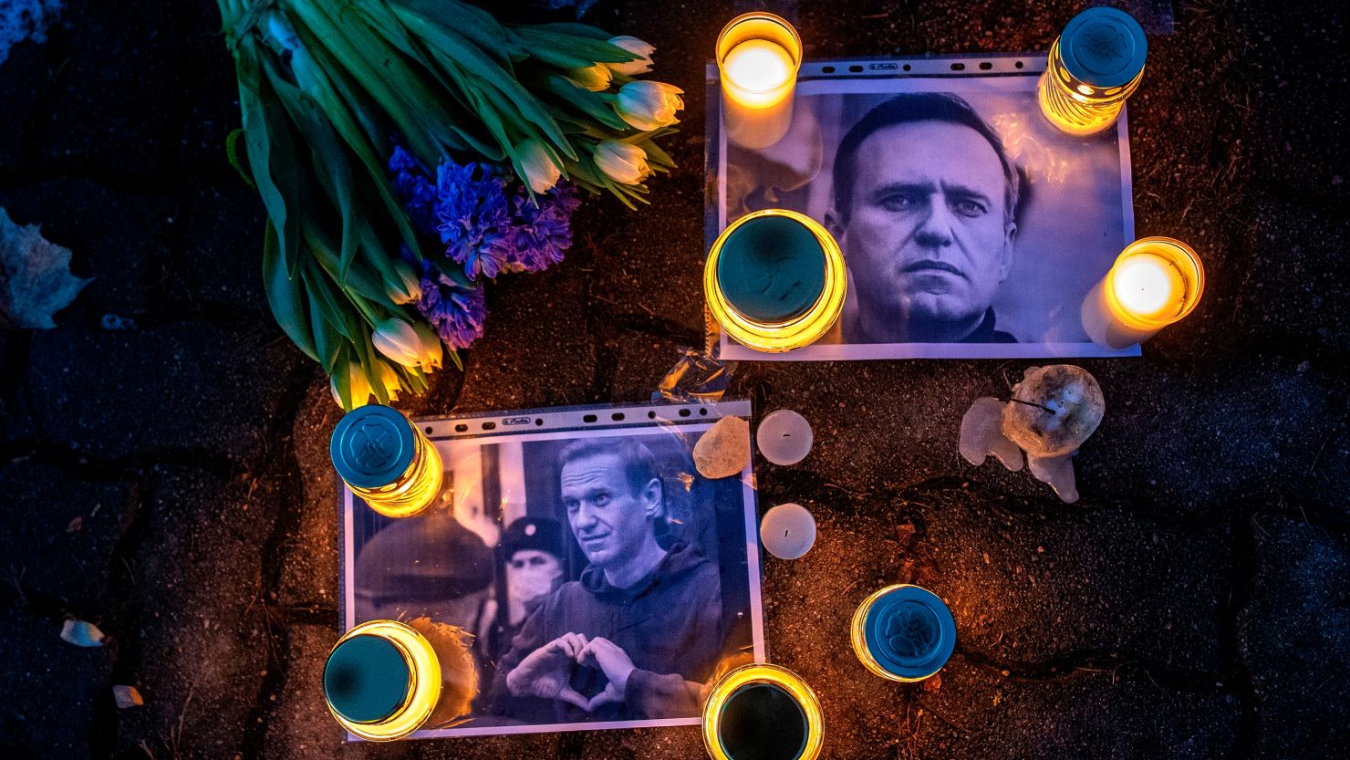 Images of Alexey Navalny are laid on a ground in front of the Russian embassy in Vilnius on Friday.