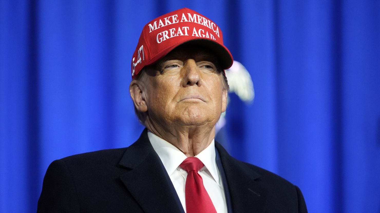 Former President Donald Trump arrives for a campaign rally in Waterford Township, Michigan, on February 17, 2024.