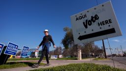 A man walks past an early voting polling site on February 20 in San Antonio, Texas.