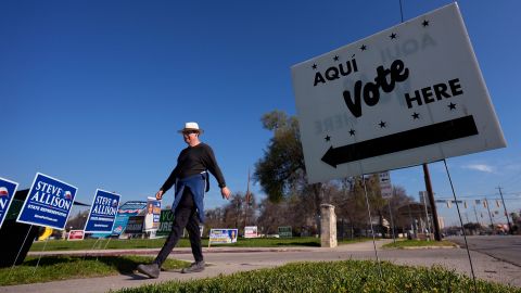 A man walks past an early voting polling site on February 20 in San Antonio, Texas.