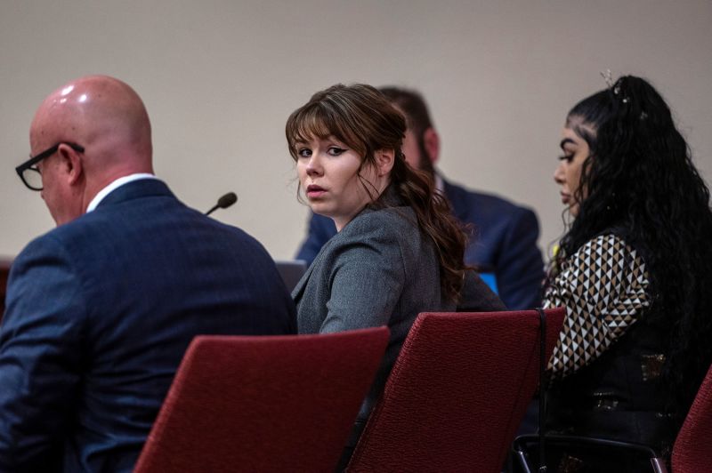 Hannah Gutierrez-Reed, center, sits with her attorney Jason Bowles, left, during the first day of testimony in the trial against her in First District Court, in Santa Fe, N.M., Thursday, February 22, 2024. Gutierrez-Reed, who was working as the armorer on the movie 