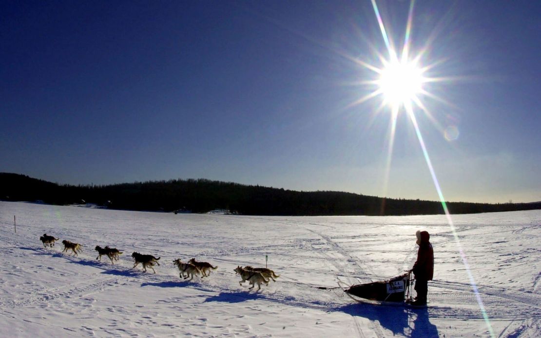 A sled dog team crosses Portage Lake in Portage, Maine, during the Can Am Crown 250 in 2001.