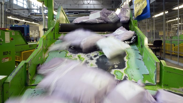 Parcels slide down a ramp after being scanned at the U.S. Customs and Border Protection overseas mail inspection facility at Chicago's O'Hare International Airport Feb. 23, 2024, in Chicago. The explosive growth of cross-border e-commerce involving major China-backed players such as Shein and Temu has caught the attention of the U.S. lawmakers amid a bitter U.S.-China trade war and cast a spotlight on a tax rule that critics say has allowed hundreds of millions of China-originated packages to enter the U.S. market each year without duty and without reliable information for lawfulness.