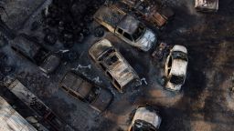 Charred vehicles sit at an auto body shop after the property was burned by the Smokehouse Creek Fire on Wednesday, February 28, in Canadian, Texas.