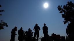 FILE - People gather near Redmond, Ore., to view the sun as it nears a total eclipse by the moon, Monday, Aug. 21, 2017. The April 8, 2024 total solar eclipse in North America first hits land at Mexicoâs Pacific coast, cuts diagonally across the U.S. from Texas to Maine and exits in eastern Canada. (AP Photo/Ted S. Warren, File)