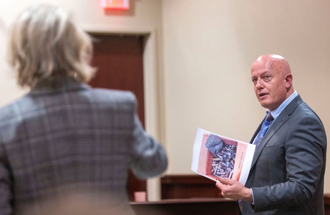 Special prosecutor Kari Morrissey, left, and defense attorney Jason Bowles discuss showing a picture to a witness during the trial.