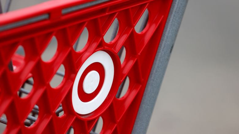 Target signage on a shopping cart outside a store front, Wednesday, Feb. 28, 2024, in Houston.