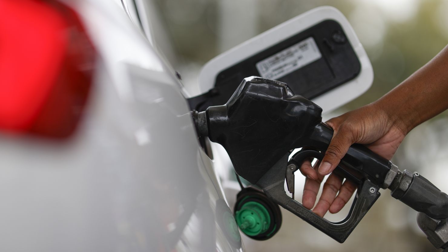 A detail view as a motorist fills up with fuel at an Exxon gas station, Friday, March 1, 2024, in Houston.
