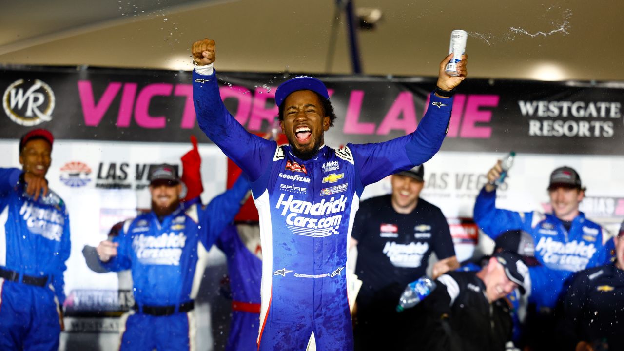Rajah Caruth celebrates after winning the Victoria's Voice Foundation 200 race.