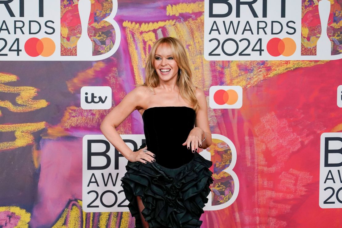 Kylie Minogue poses for photographers upon arrival at the Brit Awards 2024 in London, Saturday, March 2, 2024.