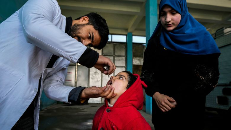 A government health worker administers polio drops to a child in Srinagar, Indian controlled Kashmir, Sunday, Mar. 3, 2024. India eradicated polio more than a decade ago after successfully implementing a polio immunization programme adopted in 1995. (AP Photo/Mukhtar Khan)