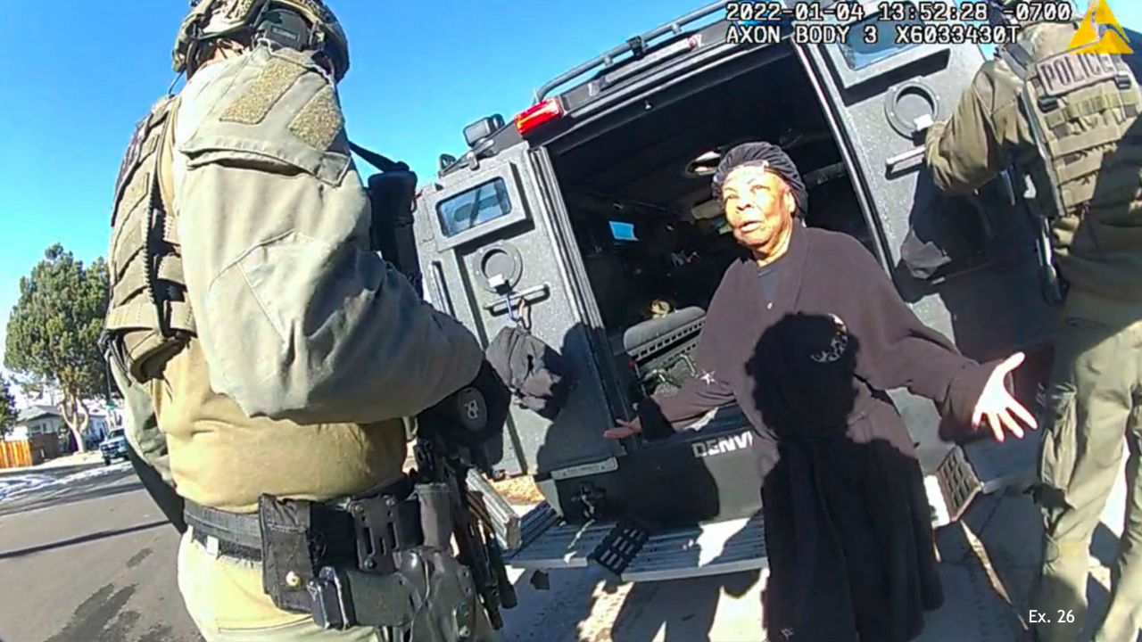 This image taken from Denver Police body camera footage provided by the American Civil Liberties Union of Colorado shows Ruby Johnson, a 78-year-old Colorado woman, surrounded by SWAT officers, Jan. 4, 2022, in Colorado. Johnson, who sued two police officers after her home was wrongly searched by a SWAT team looking for a stolen truck, won a $3.76 million jury verdict Monday, March 4, 2024, under a new Colorado law that allows people to sue police over violations of their state constitutional rights. (Denver Police Department via AP)