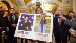 FILE - Sen. Joni Ernst, R-Iowa, holds a poster with photos of murder victims Sarah Root and Laken Riley as she speaks on Capitol Hill, Feb. 27, 2024, in Washington. House Republicans have passed a bill that would require federal authorities to detain unauthorized immigrants who have been accused of theft, seizing on the recent death of Laken, a nursing student in Georgia. The bill sends a rebuke to President Joe Bidenâs border policies just hours ahead of his State of the Union address. However, the nine-page bill had little chance of being taken up in the Democratic-controlled Senate. (AP Photo/Mark Schiefelbein, File)