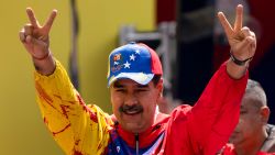 President Nicolas Maduro flashes victory signs during an event in Caracas, Venezuela, on February 29, 2024.