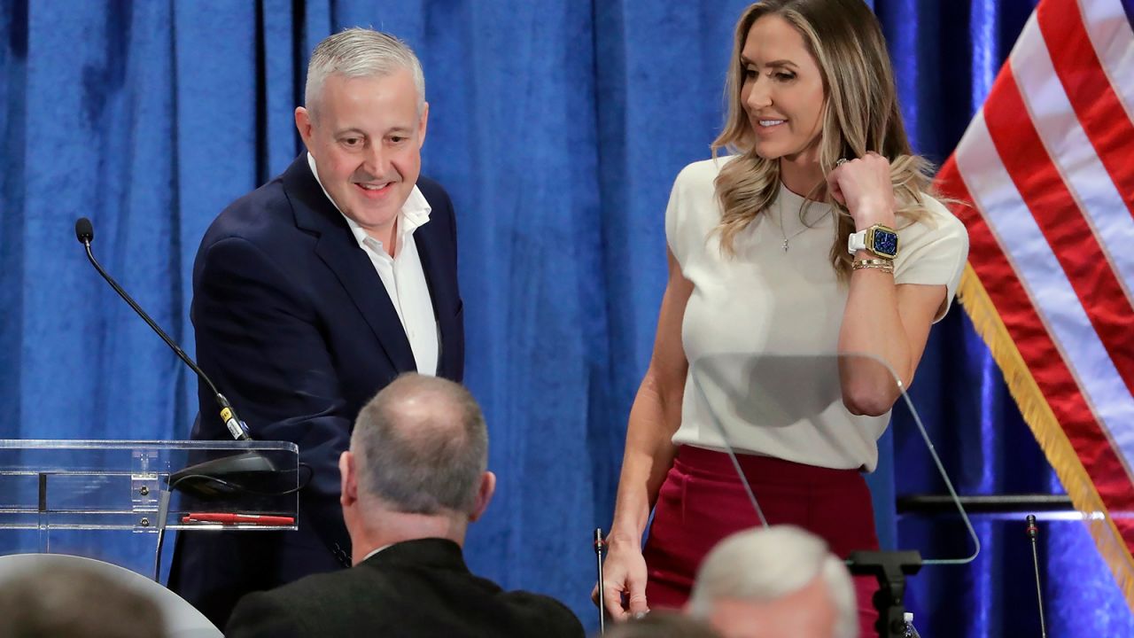 Newly-elected Chairman Michael Whatley, left, and Co-Chair Lara Trump, right, greet attendees as they crowd the podium after the general session of the Republican National Committee Spring Meeting Friday, March 8, 2024, in Houston.