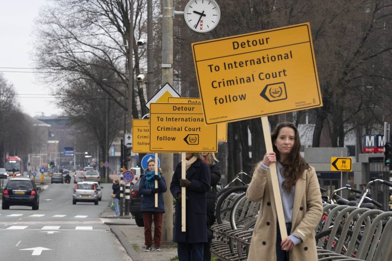 Demonstrators protest against Israel's President Isaac Herzog attending the opening of the new National Holocaust Museum.