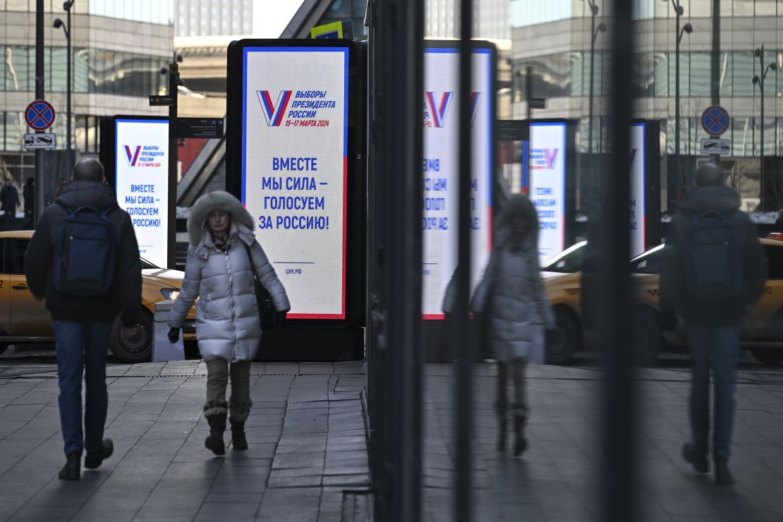 "Together we are strong, we vote for Russia!" reads a billboard in Moscow's business district, March 12, 2024.