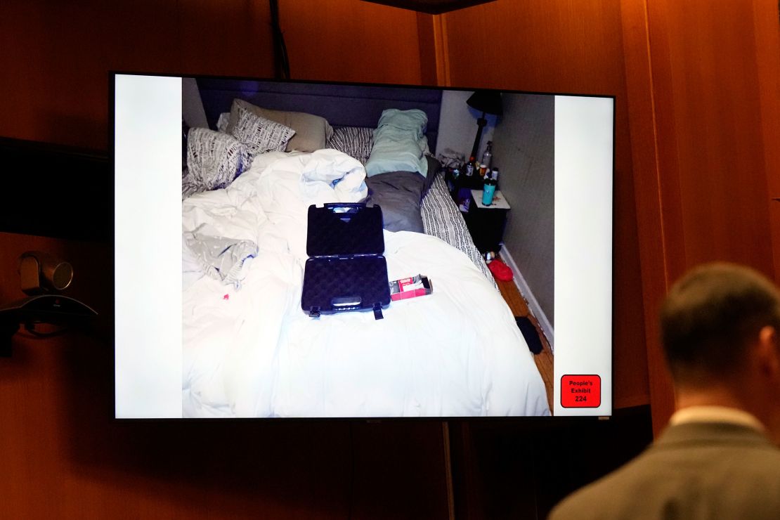 An empty gun case and ammunition box are seen on the bed of James and Jennifer Crumbley in an evidence exhibit shown in court on Tuesday.