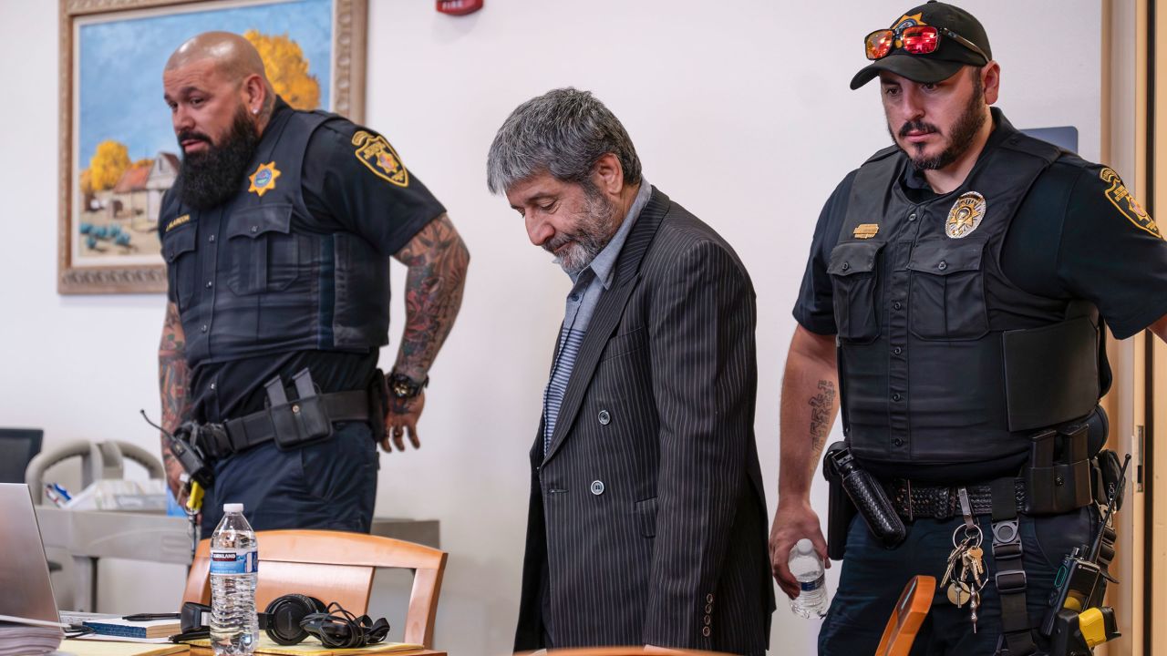 Muhammad Syed enters the court room before opening statements at the Bernalillo County Courthouse in Downtown Albuquerque, N.M,, on Tuesday, March 12, 2024. Syed, an Afghan refugee, is accused in the slayings of three Muslim men in Albuquerque.  (Chancey Bush/The Albuquerque Journal via AP, Pool)