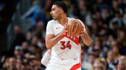 Jontay Porter, then a center for the Toronto Raptors, plays against the Denver Nuggets in Denver on March 11.