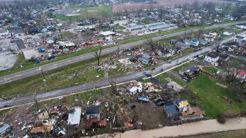 Debris scatters the ground near damaged homes following a severe storm Friday, March 15, 2024, in Lakeview, Ohio. (AP Photo/Joshua A. Bickel)