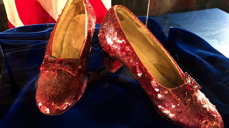FILE - Ruby slippers once worn by Judy Garland in the "The Wizard of Oz," are displayed at a news conference, Sept. 4, 2018, at the FBI office in Brooklyn Center, Minn. A second man has been charged in connection with the 2005 theft of a pair of the ruby slippers, according to an indictment unsealed Sunday, March 17, 2024. (AP Photo/Jeff Baenen, File)