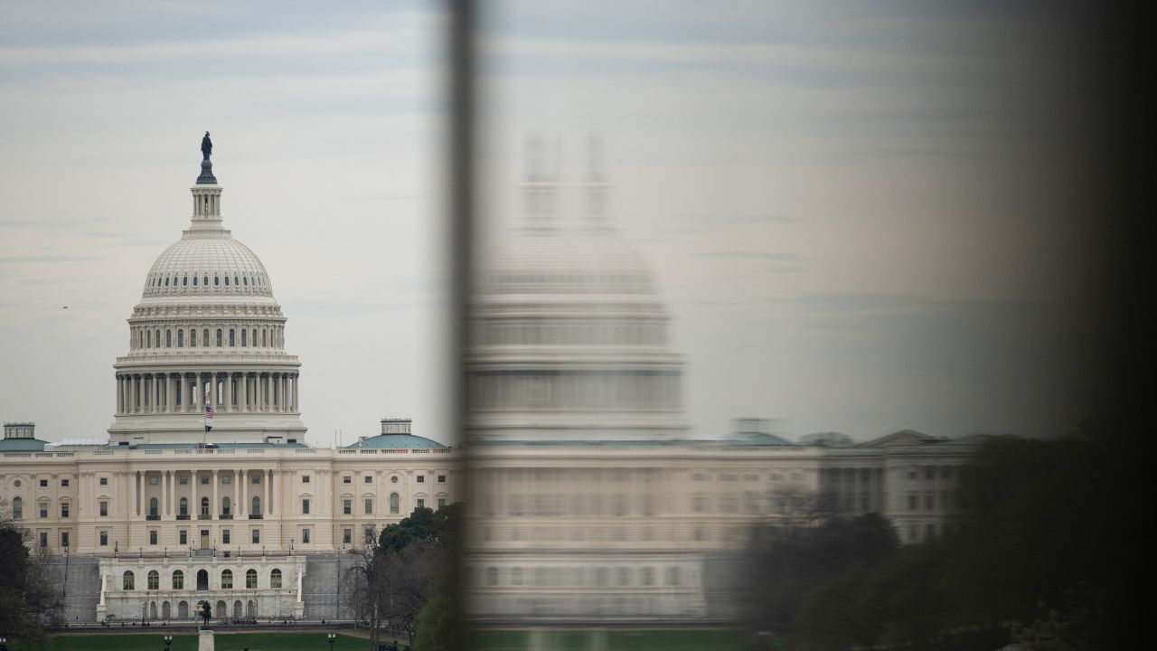 A general view of U.S. Capitol Building next to a reflection on a window, in Washington, D.C., on Friday, March 15, 2024. (Graeme Sloan/Sipa USA)(Sipa via AP Images)