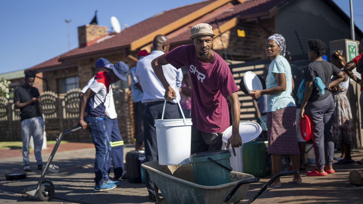 Residents of the township of Soweto, South Africa, queue for water on March 16, 2024 as Johannesburg experiences severe water shortages.