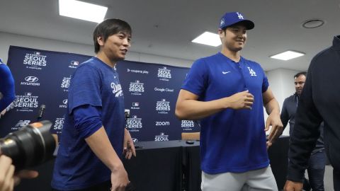 Los Angeles Dodgers' Shohei Ohtani, right, and his interpreter, Ippei Mizuhara, leave after a news conference ahead of a baseball workout at Gocheok Sky Dome in Seoul, South Korea, Saturday, March 16, 2024. Ohtaniâs interpreter and close friend has been fired by the Dodgers following allegations of illegal gambling and theft from the Japanese baseball star. (AP Photo/Lee Jin-man)