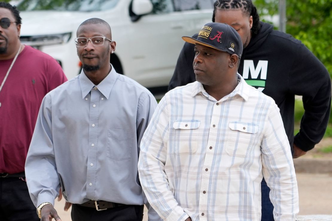 Michael Corey Jenkins, left, and Eddie Terrell Parker walk toward the Thad Cochran United States Courthouse in Jackson, Mississippi, on Thursday.