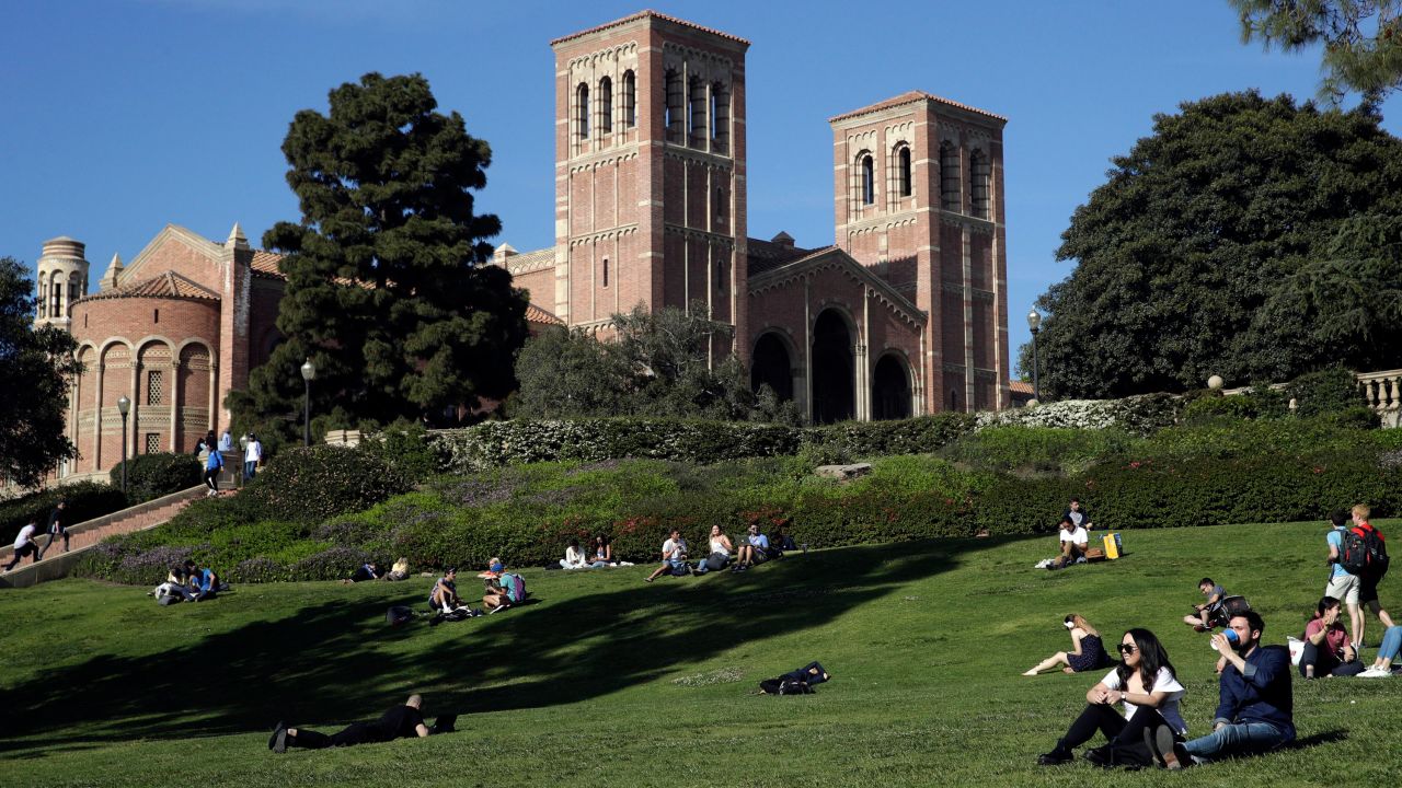 FILE - Students sit on the lawn near Royce Hall at the University of California, Los Angeles, in the Westwood section of Los Angeles on April 25, 2019. On Thursday, March 21, 2024, the California Legislature voted to extend the deadline for some state student financial aid programs in response to delays with the Free Application for Federal Student Aid, or FAFSA. (AP Photo/Jae C. Hong, File)