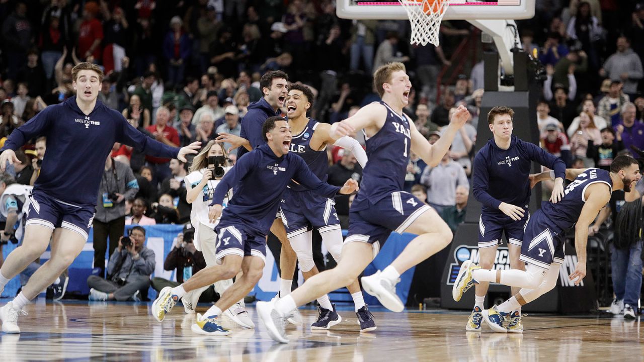 Yale players celebrate after their win over Auburn in a first-round college basketball game in the NCAA Tournament in Spokane, Wash., Friday, March 22, 2024. (AP Photo/Young Kwak)
