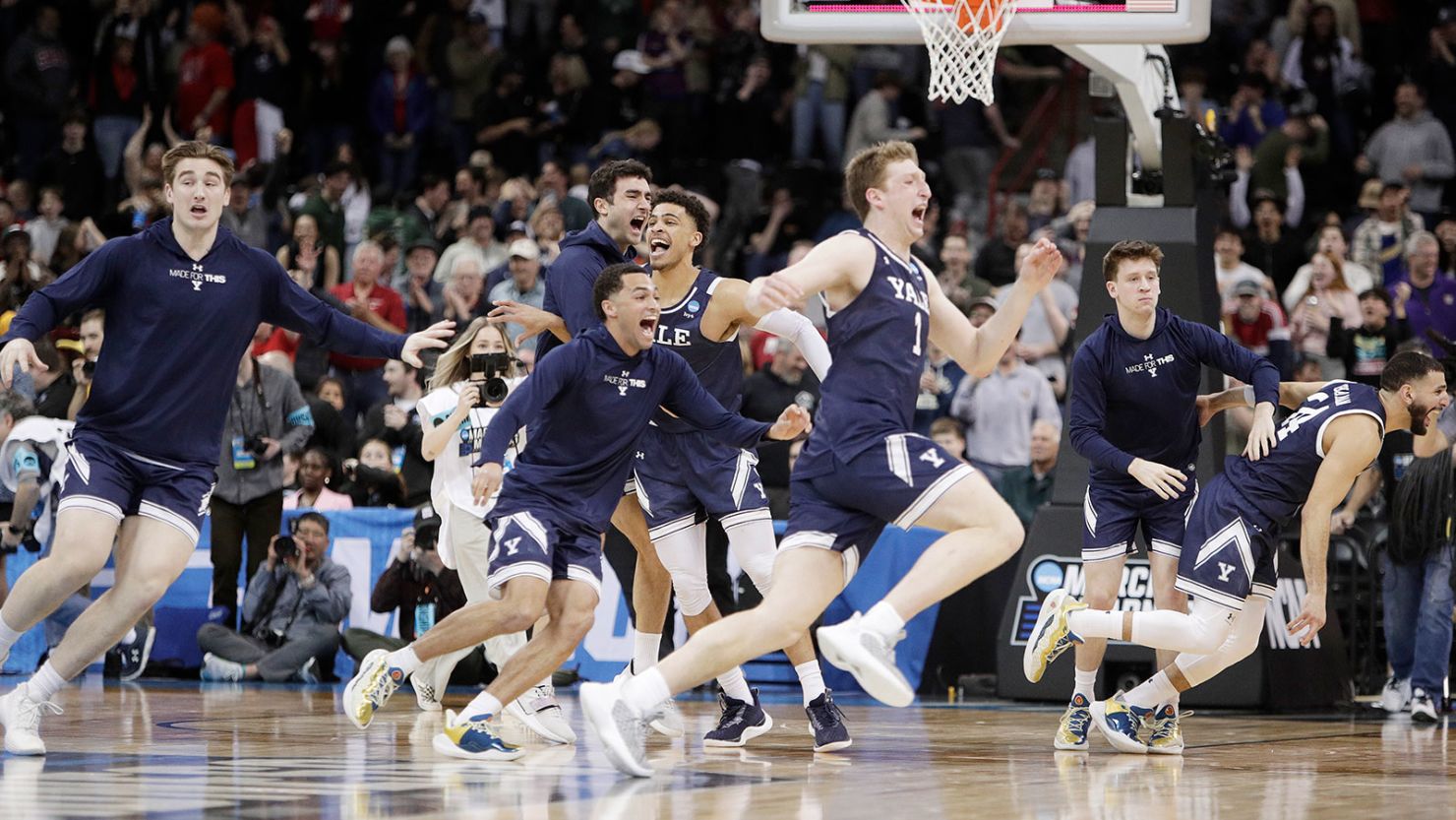 Yale players celebrate after their win over Auburn in the first round of the NCAA men's basketball tournament in Spokane, Washington on March 22, 2024.