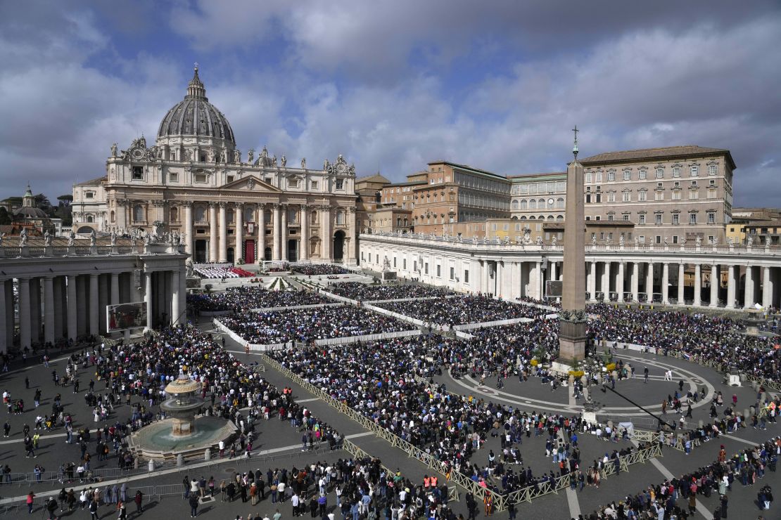 Crowds gather in St. Peter's Square during the Palm Sunday mass.