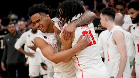 Houston guard Ramon Walker Jr. (left) and guard Emanuel Sharp celebrate the team's win over Texas A&M at March Madness.