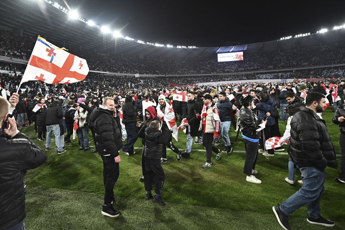 Georgia's fans celebrate their team reaching Euro 2024 at the Boris Paichadze National Stadium in Tbilisi.